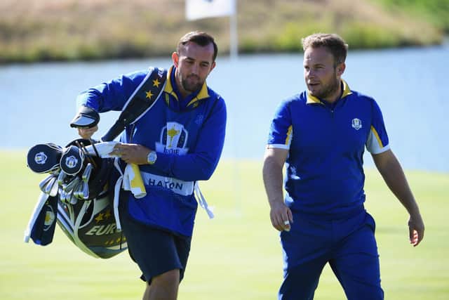 Mark Crane, left, caddying for Tyrrell Hatton at the 2018 Ryder Cup. Picture: Getty.