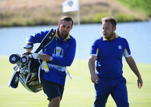Mark Crane, left, caddying for Tyrrell Hatton at the 2018 Ryder Cup. Picture: Getty.