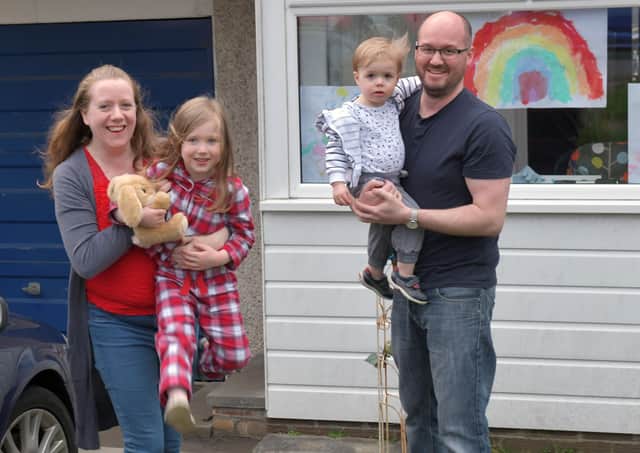 Residents of Banknock, near Falkirk, gather on their doorsteps at 7pm to sing Reach for the Stars (Picture: Michael Gillen)