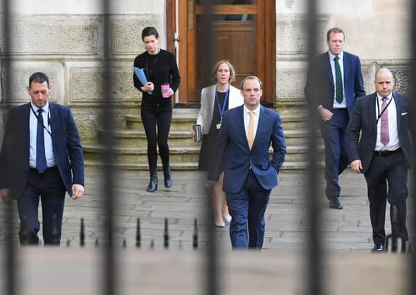Foreign Secretary Dominic Raab and colleagues practice social distancing as they arrive in Downing Street (Picture: Stefan Rousseau/PA Wire)