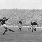 Dougie Morgan – former Scotland captain and British Lion, who died just two weeks ago – kicks one of his three penalties as the Scots beat Wales 12-10 in front of 104,000 fans, a world record crowd that would stand until 1999. Picture: DC Thomson