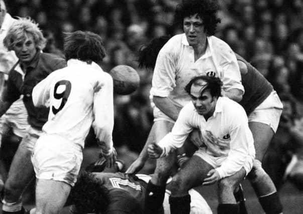 George Mackie and Colin Telfer (right) prepare to receive the ball from team-mate Dougie Morgan during Scotland’s 6-13 defeat to France at Murrayfield in 1976 (Picture: SNS)