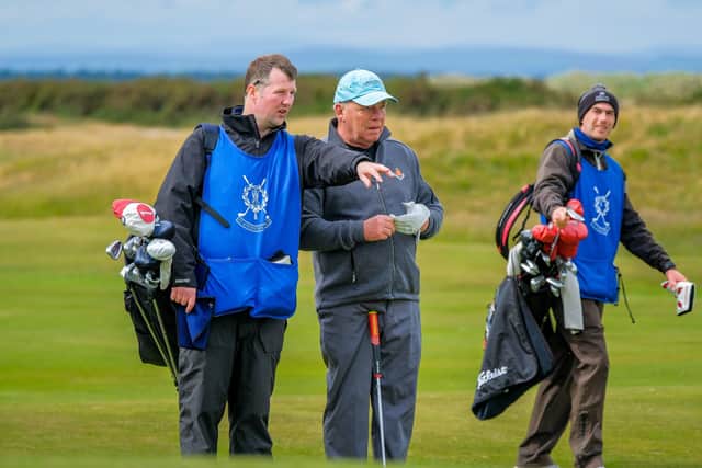St Andrews caddie master Fraser Riddler, left, set up the fund.