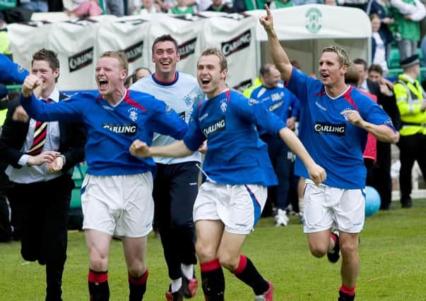 Michael Ball, left, celebrates with his team-mates after Rangers won the title at Easter Road on 'Helicopter Sunday' in 2005. Picture: Bill Murray/SNS