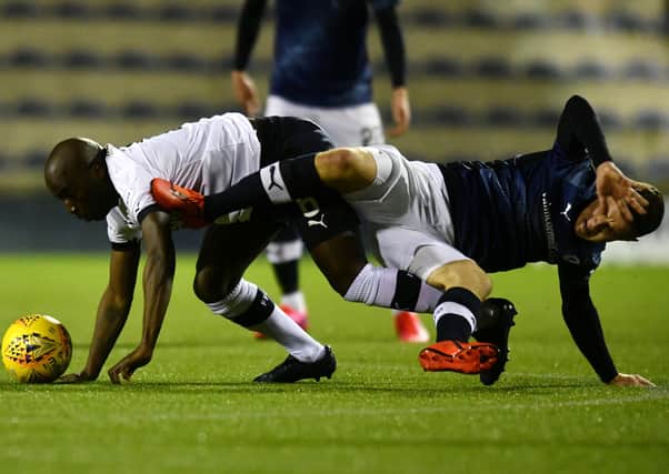 Morgaro Gomis, left, and Ross Matthews tussle during champions Raith Rovers’ 1-1 draw with Falkirk last month. Picture: Michael Gillen