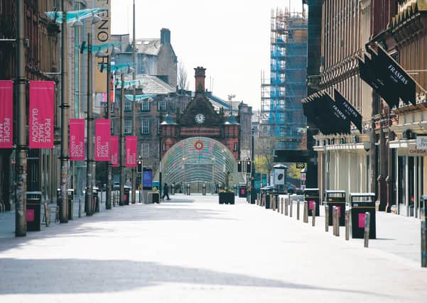 Buchanan Street stands empty on April 13, with Glasgow's usually busy shopping district closed due to lockdown. Picture: Craig Williamson