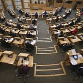 MSPs social distancing with every second seat removed at the Scottish Parliament, Holyrood, in Edinburgh. Picture: Fraser Bremner/PA Wire
