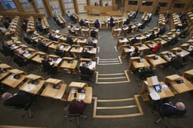 MSPs social distancing with every second seat removed at the Scottish Parliament, Holyrood, in Edinburgh. Picture: Fraser Bremner/PA Wire