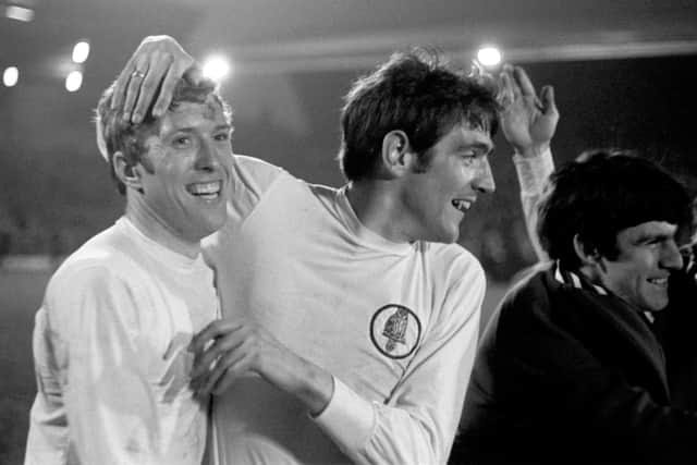 Norman Hunter (right)  and Mick Jones celebrate wrapping up the 1969 League Championship with a 0-0 draw at Liverpool (Picture: PA)