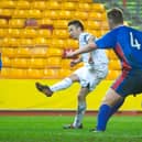 Barry Nicholson slots the ball past Caley keeper Mark Brown. Picture: Jeff Holmes/SNS