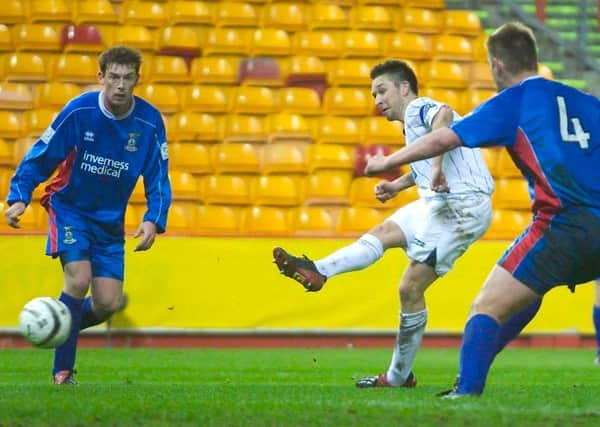 Barry Nicholson slots the ball past Caley keeper Mark Brown. Picture: Jeff Holmes/SNS