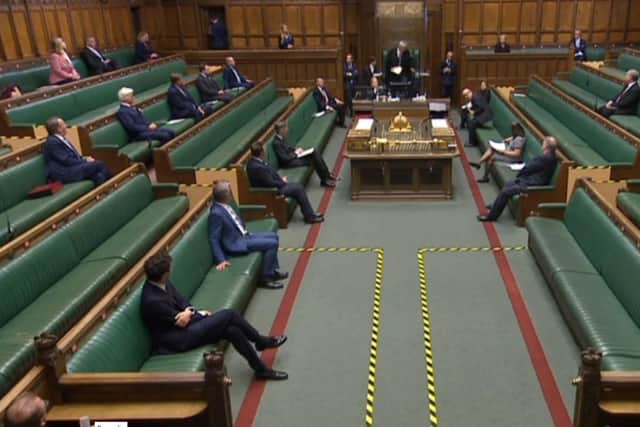 A video grab from footage broadcast by the UK Parliament's Parliamentary Recording Unit (PRU) shows Members of Parliament sitting in the Chamber in the House of Commons where social distancing measures have been put in place. Picture: Getty Images