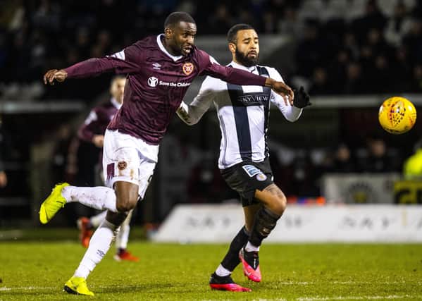 Clevid Dikamona, battling with St Mirren’s Alex Jakubiak, finds it difficult to explain why Hearts have plumbed the depths in the Premiership. Picture: SNS.