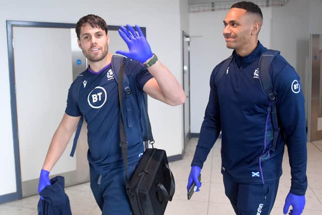 Wingers Sean Maitland, left, and Ratu Tagive wearing gloves at Edinburgh Airport as Scotland checked in for their flight to Cardiff amid concerns over the coronavirus outbreak. Picture: Gary Hutchison/SNS