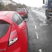 Potholed cycle lane on resurfaced road in Alderman Road, Knightswood, Glasgow. Picture: Jpimedia
