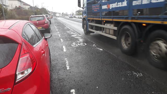 Potholed cycle lane on resurfaced road in Alderman Road, Knightswood, Glasgow. Picture: Jpimedia