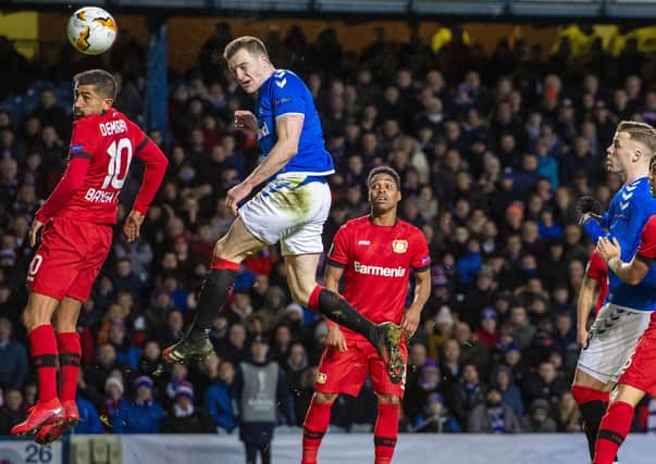 Rangers defender George Edmundson heads home to make it 2-1 after conceding apenalty following a VAR ruling. Picture: Craig Williamson/SNS