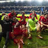 Bayer Leverkusen players celebrate their 3-1 win over Rangers in the first leg of the Europa League last-16 tie at Ibrox. Picture: SNS