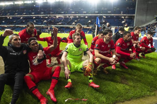 Bayer Leverkusen players celebrate their 3-1 win over Rangers in the first leg of the Europa League last-16 tie at Ibrox. Picture: SNS