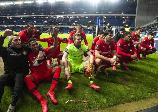 Bayer Leverkusen players celebrate their 3-1 win over Rangers in the first leg of the Europa League last-16 tie at Ibrox. Picture: SNS