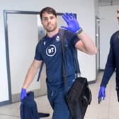 Scotland's Sean Maitland and Ratu Tagive wear gloves as they pass through Edinburgh Airport on Thursday (Picture: Gary Hutchison / SNS Group)