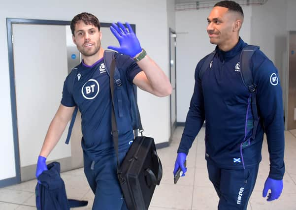 Scotland's Sean Maitland and Ratu Tagive wear gloves as they pass through Edinburgh Airport on Thursday (Picture: Gary Hutchison / SNS Group)