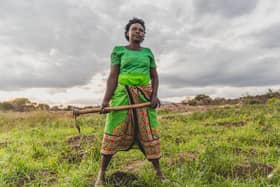 Faith Muvili is now able to collect water for her crops thanks to a nearby dam (Picture: Adam Finch)