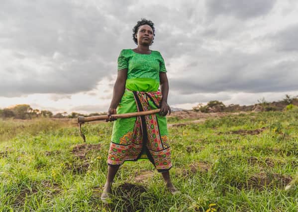 Faith Muvili is now able to collect water for her crops thanks to a nearby dam (Picture: Adam Finch)