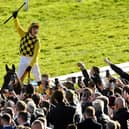 Paul Townend salutes the crowd after his Gold Cup victory on Al Boum Photo.
