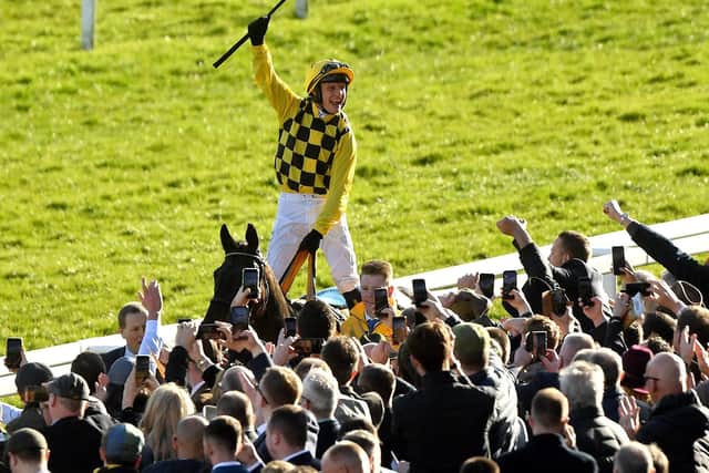 Paul Townend salutes the crowd after his Gold Cup victory on Al Boum Photo.