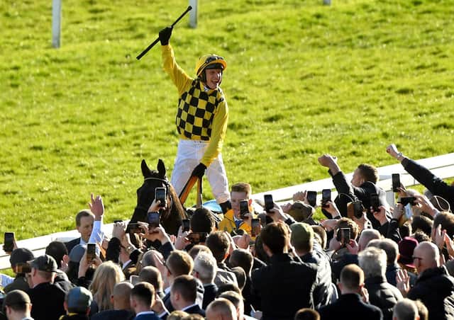 Paul Townend salutes the crowd after his Gold Cup victory on Al Boum Photo.