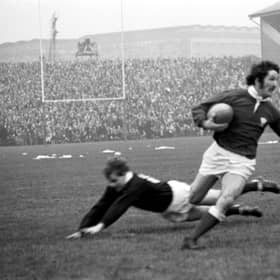 Gerald Davies jinks past Ian Smith to score a try in his country’s thrilling 19-18 win over Scotland at Murrayfield in February 1971