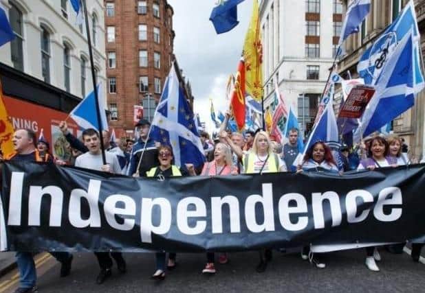 Marchers make their way through Glasgow during a pro-independence rally in January