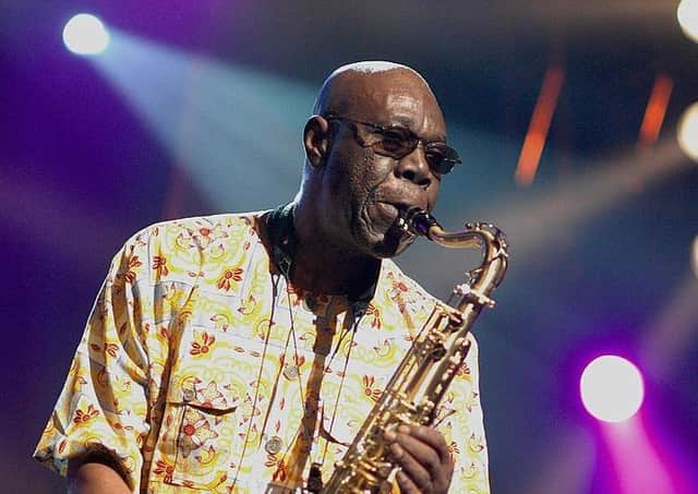 Johannesburg, SOUTH AFRICA: African super star saxophanist Manu Dibangu, with his Soul Makossa Gang, performs at the 7th Annual Cape Town International Jazz Festival, 31 March 2006. This renowned Cameroonian musician mixes jazz with some traditional African influences, and even a bit of reggae into his music. AFP PHOTO RODGER BOSCH (Photo credit should read RODGER BOSCH/AFP via Getty Images)