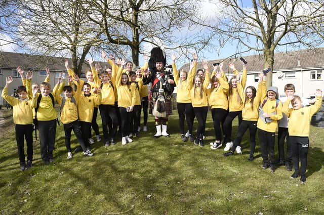 Piper Cameron McKay visited Hawthornden Primary in Bonnyrigg to pipe out the school's primary seven pupils on Friday. Picture: Greg Macvean