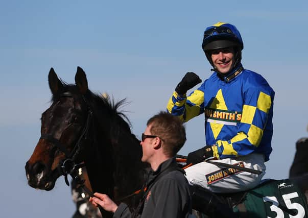 Galashiels jockey Ryan Mania steered outsider Aurora’s Encore to glory in the 2013 Grand National at Aintree. Picture: Julian Finney/Getty