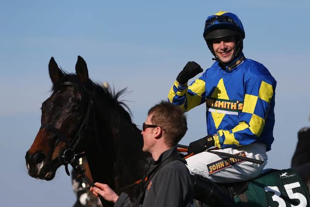 Galashiels jockey Ryan Mania steered outsider Aurora’s Encore to glory in the 2013 Grand National at Aintree. Picture: Julian Finney/Getty