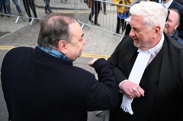 Alex Salmond bumps elbows with Gordon Jackson QC as he departs the High Court in Edinburgh on March 23. Picture: Jeff J Mitchell / Getty