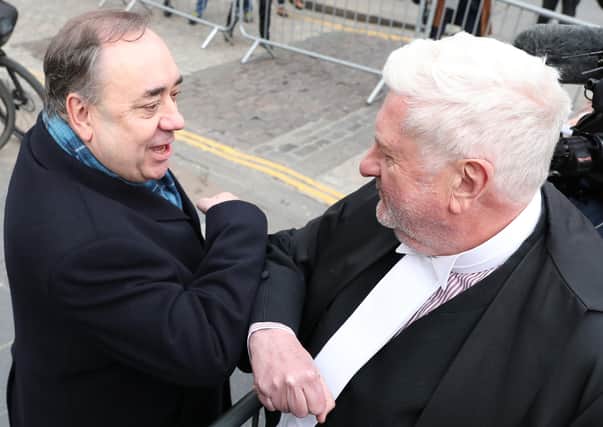 Alex Salmond elbow bumps Gordon Jackson QC as he leaves the High Court in Edinburgh after he was cleared of several sex-offence charges (Picture: Andrew Milligan/PA Wire)