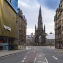 The streets of central Edinburgh may empty during lockdown, but the capital's economy continues to function. Picture: Mark Scates/SNS