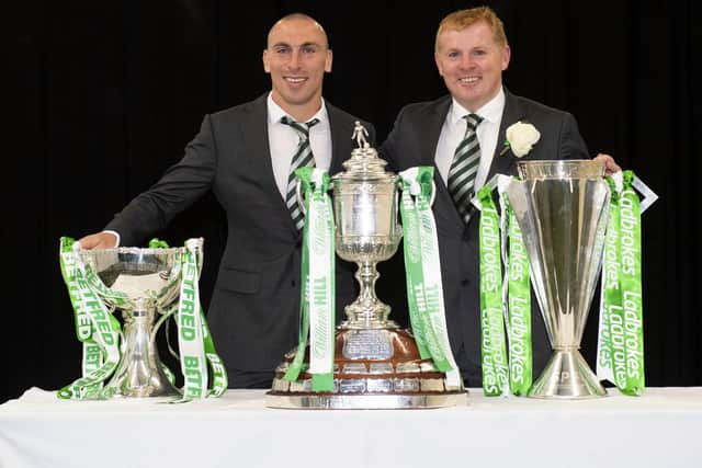 Celtic manager Neil Lennon, right, and captain Scott Brown with all three major Scottish trophies after completing an unprecedented treble treble with victory in the Scottish Cup final. Picture: Craig Foy/SNS