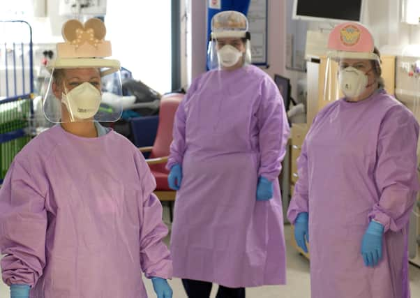 Staff at Glasgow Children's Hospital have come together to decorate their visors with in an attempt to cheer up their young patients during the pandemic.