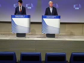 Empty seats are seen in the first two rows as European Union's Brexit negotiator Michel Barnier (R) speaks during a news conference following the third round of Brexit talks. Picture: Getty