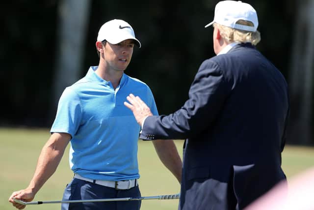 Rory McIlroy, left, with Donald Trump. Picture: Mike Ehrmann/Getty