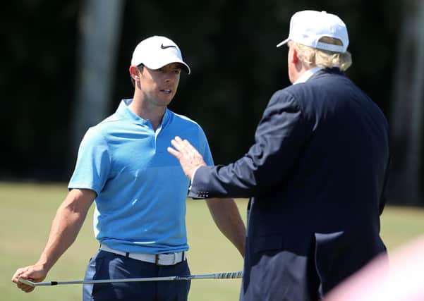 Rory McIlroy, left, with Donald Trump. Picture: Mike Ehrmann/Getty