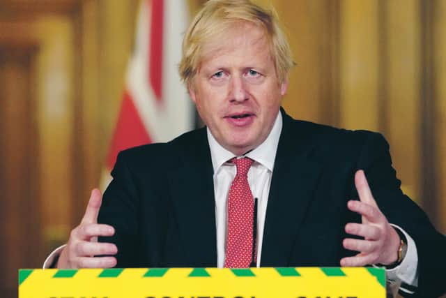 Prime Minister Boris Johnson delivers a Downing Street press conference