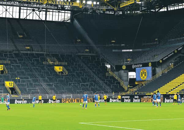 Bundesliga action returned in Germany yesterday but there was no 'Yellow Wall' for Dortmund's win over Schalke. Picture: Martin Meissner/AFP/Getty