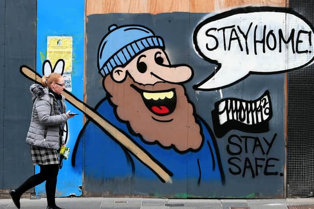 A graffiti art work saying 'Stay Home' has appeared in Glasgow city centre. Firms are wanting clear guidance on how to exit the Scottish lockdown. Picture: John Devlin
