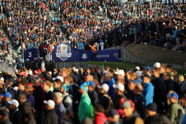 A packed gallery looks on as Rory McIlroy tees off during the 2018 Ryder Cup at Le Golf National in Paris. Picture: Richard Heathcote/Getty