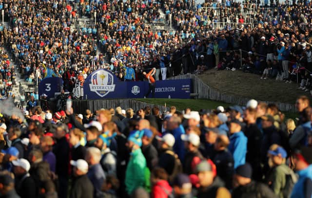 A packed gallery looks on as Rory McIlroy tees off during the 2018 Ryder Cup at Le Golf National in Paris. Picture: Richard Heathcote/Getty